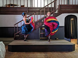 Saloon girls performing the dance.