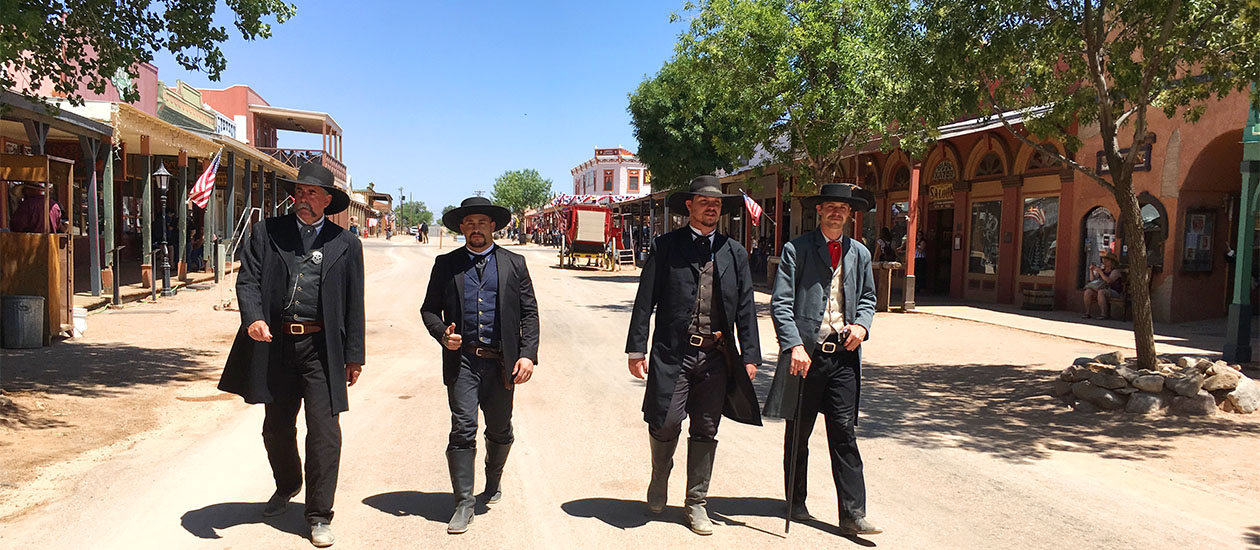 Wyatt, Virgil, Morgan and Doc Holliday walking down the street.