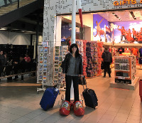 At the Schiphol airport: My wife in the typical Amsterdam shoes klompen.
