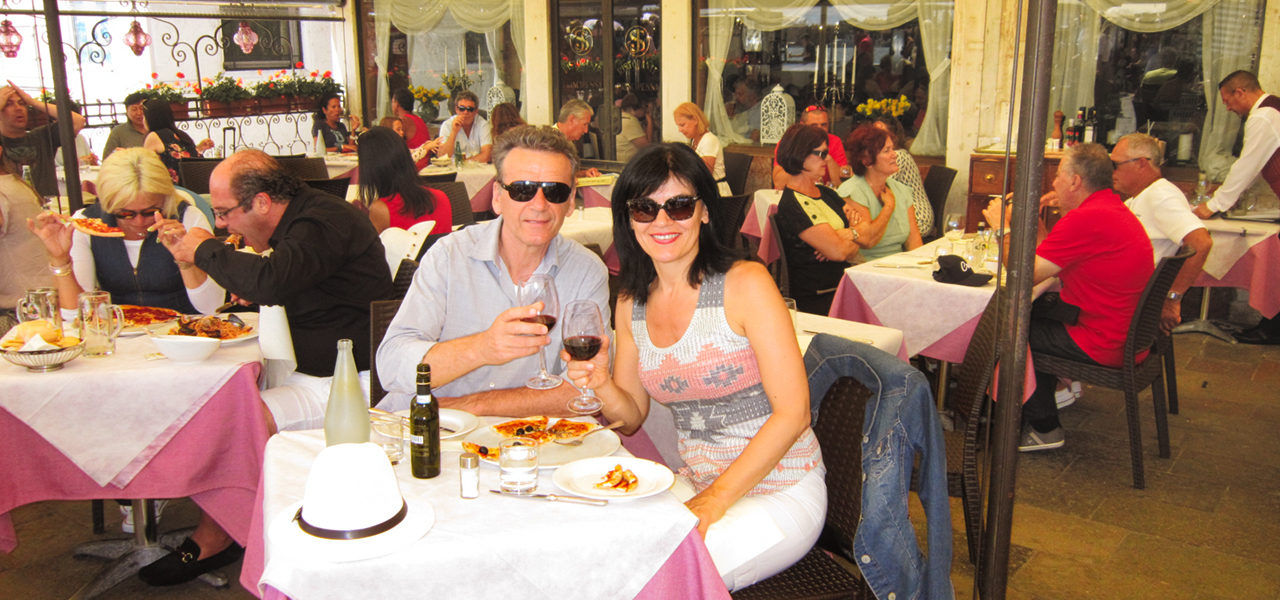The image of me and my wife in one of many restaurants in Venice