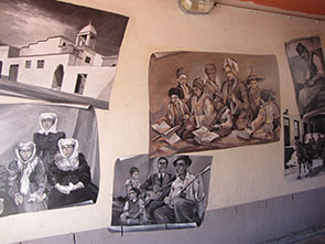 Bo-Kaap street image. The painting on the wall about the history of the settlement.