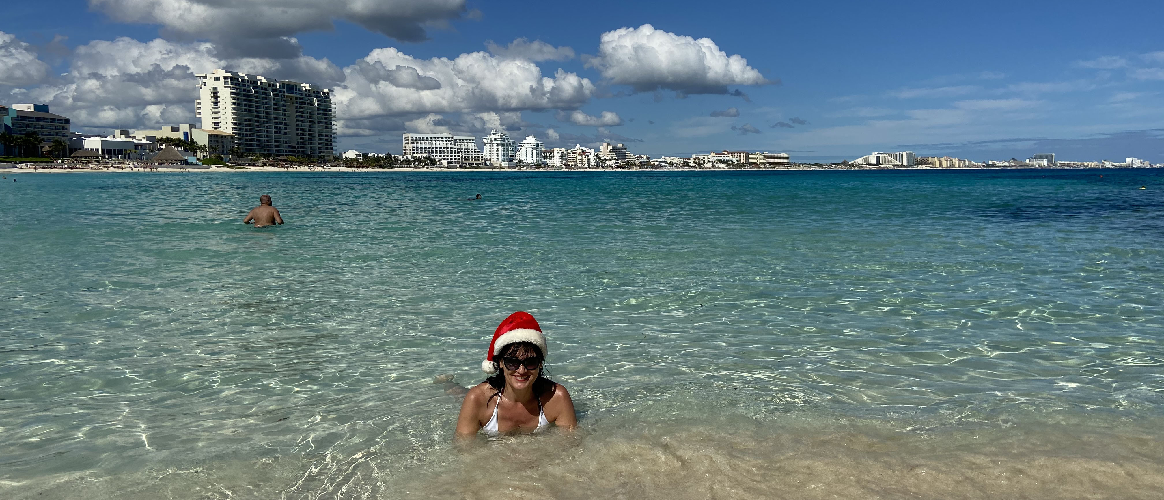 My wife with the Christmas cap in water