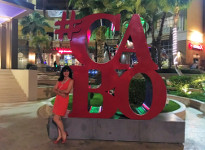 My wife and the Cabo sign in Cabo San Lucas marina